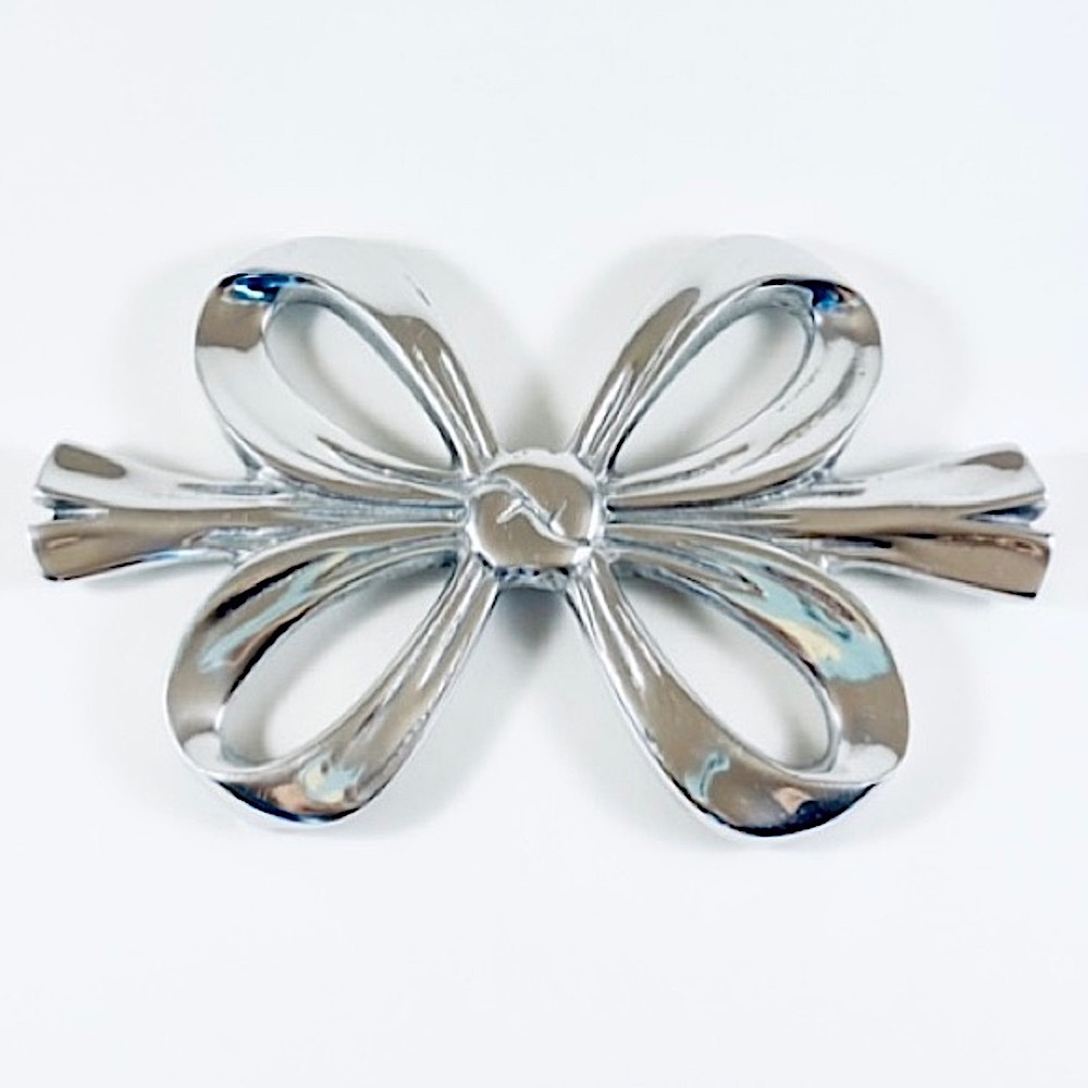 Handmade Mexican pewter ribbon bow trivet